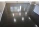 Close up on the newly installed dark hardwood flooring that has a high gloss finish at 1988 Glenmar Dr, Decatur, GA 30032