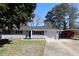 Single-story home with a front yard, a car port in the rear, and neutral paint scheme at 1988 Glenmar Dr, Decatur, GA 30032