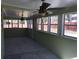 The sunroom features a ceiling fan, and plenty of windows at 1988 Glenmar Dr, Decatur, GA 30032