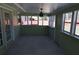 The sunroom has multiple windows and a ceiling fan at 1988 Glenmar Dr, Decatur, GA 30032