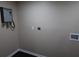 Neutral interior featuring a wall-mounted water heater, electrical outlet, and laundry hookups at 1988 Glenmar Dr, Decatur, GA 30032