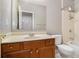 Bathroom with wood vanity and neutral tile flooring at 7606 Forest Glen Way, Lithia Springs, GA 30122