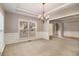 Formal dining room with chandelier and neutral decor at 7606 Forest Glen Way, Lithia Springs, GA 30122