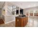 Kitchen island with cooktop and breakfast bar at 7606 Forest Glen Way, Lithia Springs, GA 30122