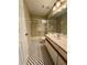 Bathroom featuring a shower over tub, patterned tile flooring, and sink with vanity at 306 Hawkstone Way, Alpharetta, GA 30022