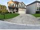Two-story brick home with a large driveway and landscaped lawn at 3746 Wood Hollow Way, Snellville, GA 30039
