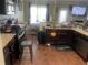 Spacious kitchen featuring granite countertops and dark wood cabinets at 3746 Wood Hollow Way, Snellville, GA 30039