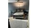Spacious bedroom with ceiling fan and plush carpeting at 6540 Old White Mill Rd, Fairburn, GA 30213