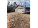 Attached garage with a double door, offering ample parking space at 6540 Old White Mill Rd, Fairburn, GA 30213