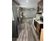 Modern kitchen with stainless steel appliances and wood cabinets at 6540 Old White Mill Rd, Fairburn, GA 30213