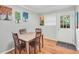 Simple dining area with a wooden table and chairs, and access to backyard at 1683 Briarcliff Rd, Atlanta, GA 30306