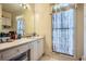 Bathroom with single sink vanity and large window at 39 Lambeth Dr, Hiram, GA 30141