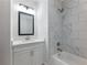 Modern bathroom with white vanity and marble shower at 4064 Hosch Retreat Dr, Buford, GA 30519