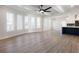 Bright living room featuring hardwood floors and multiple windows at 4064 Hosch Retreat Dr, Buford, GA 30519