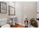 Stylish powder room with pedestal sink and unique decor at 4095 Northridge Dr, Cumming, GA 30040