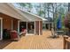 Relaxing deck with seating area, adjacent to the house at 10170 Cedar Grove Rd, Chattahoochee Hills, GA 30213