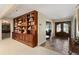 Grand entryway with tile floors and built-in shelving at 10170 Cedar Grove Rd, Chattahoochee Hills, GA 30213