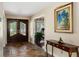 Entryway with tile floor, console table, and access to other rooms at 10170 Cedar Grove Rd, Chattahoochee Hills, GA 30213