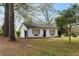 Charming white cottage with shutters and lush lawn at 10170 Cedar Grove Rd, Chattahoochee Hills, GA 30213