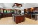 Island kitchen with granite countertops and high-end appliances at 10170 Cedar Grove Rd, Chattahoochee Hills, GA 30213