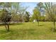 Open pasture with trees and a white fence at 10170 Cedar Grove Rd, Chattahoochee Hills, GA 30213