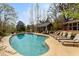 Inviting kidney-shaped pool with lounge chairs at 10170 Cedar Grove Rd, Chattahoochee Hills, GA 30213