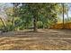 Yard with large tree and wooden fence at 2930 Kimmeridge Dr, Atlanta, GA 30344