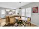 Bright dining area with wood floors and a round wooden table at 2930 Kimmeridge Dr, Atlanta, GA 30344