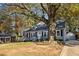 Gray house with white trim, large tree, and driveway at 2930 Kimmeridge Dr, Atlanta, GA 30344