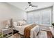 Bright bedroom with neutral decor, ceiling fan, and hardwood floors at 1095 Tucker Ave # 501, Atlanta, GA 30310