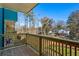 Private deck with wooden railing offers backyard and neighborhood views at 1095 Tucker Ave # 501, Atlanta, GA 30310