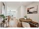 Bright dining area with wooden table and view into the living room at 1095 Tucker Ave # 501, Atlanta, GA 30310