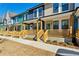 Row of charming townhouses with colorful exteriors and front porches at 1095 Tucker Ave # 501, Atlanta, GA 30310