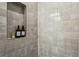 Shower with grey tile and built-in niche for toiletries at 1095 Tucker Ave # 501, Atlanta, GA 30310