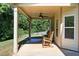 Relaxing back porch with ceiling fan and rocking chairs at 307 Cinnamon Bark Pass, Locust Grove, GA 30248