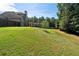 Spacious backyard with sloped grass area at 307 Cinnamon Bark Pass, Locust Grove, GA 30248