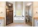 Primary bathroom with soaking tub, shower, and granite vanity at 307 Cinnamon Bark Pass, Locust Grove, GA 30248