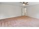 Bright bedroom featuring carpet and a ceiling fan at 307 Cinnamon Bark Pass, Locust Grove, GA 30248