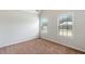 Bedroom with carpet, two windows, and neutral decor at 307 Cinnamon Bark Pass, Locust Grove, GA 30248