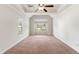 Large bedroom with carpeted floors and ceiling fan at 307 Cinnamon Bark Pass, Locust Grove, GA 30248