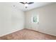 Bright bedroom with plush carpet and exterior access at 307 Cinnamon Bark Pass, Locust Grove, GA 30248