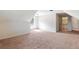 Large bedroom with sloped ceiling and carpet flooring at 307 Cinnamon Bark Pass, Locust Grove, GA 30248
