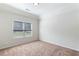 Well-lit bedroom with neutral walls and carpet at 307 Cinnamon Bark Pass, Locust Grove, GA 30248