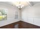 Formal dining room featuring hardwood floors and wainscoting at 307 Cinnamon Bark Pass, Locust Grove, GA 30248