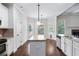 Spacious kitchen with island, granite countertops, and white cabinets at 307 Cinnamon Bark Pass, Locust Grove, GA 30248