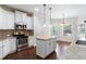 Kitchen with white cabinets, granite countertops and stainless steel appliances at 307 Cinnamon Bark Pass, Locust Grove, GA 30248