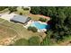 Community pool with lounge chairs and a clubhouse at 307 Cinnamon Bark Pass, Locust Grove, GA 30248