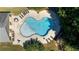 An aerial view of kidney shaped community pool and surrounding patio at 307 Cinnamon Bark Pass, Locust Grove, GA 30248