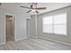 Bright bedroom with hardwood floors and a ceiling fan at 315 Lakestone Lndg, Woodstock, GA 30188