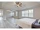 Spacious main bedroom with large windows and ceiling fan at 315 Lakestone Lndg, Woodstock, GA 30188